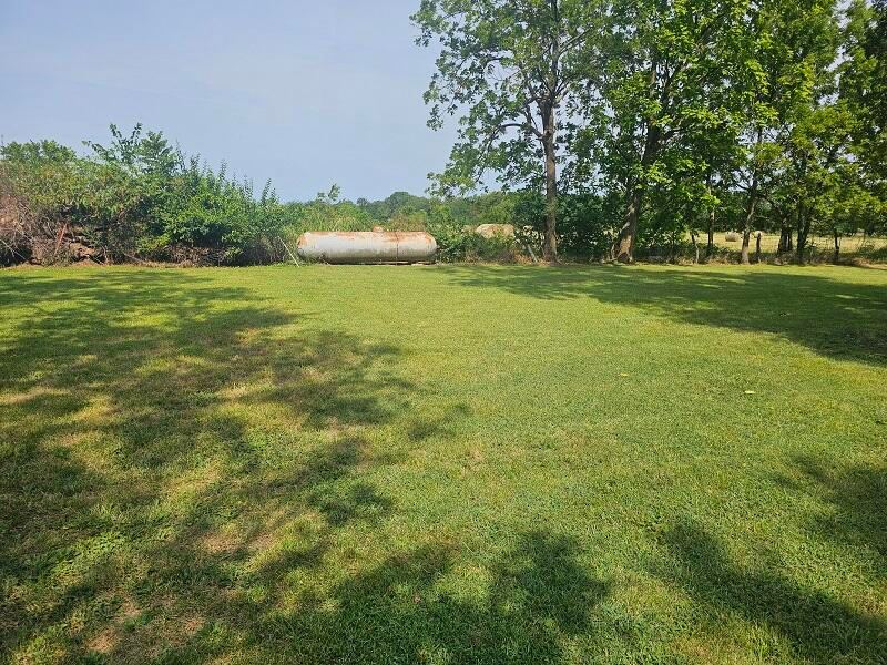 Backyard and propane tank at 3117 N Farm Road 123, Springfield, MO 65803